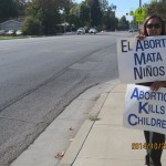 Aborto Mata Ninos and Abortion Kills Children signs at Life Chain.