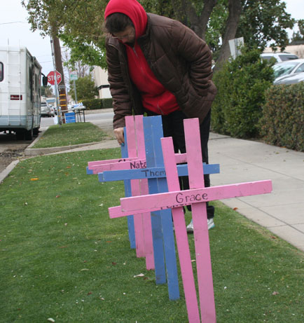 Terri places crosses in front of abortion chamber on first abortion day of 40 Days for Life